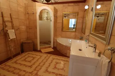 a bathroom with a tub and a sink and a bath tub at TheBougainVilla our Oceanview Villa in the Hills in Boliqueime