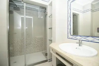 a bathroom with a sink and a shower at BelaVista Tenis SweetHouse in Albufeira