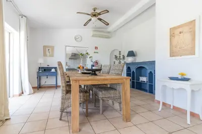 a living room with a couch and a table at Farm of Dreams Algarve in Almancil