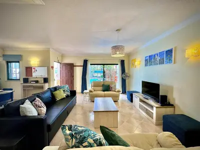 a living room with a couch and a table at Albufeira Summer Villa 1 With Pool by Homing in Albufeira