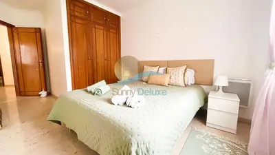 a bedroom with a bed with towels on it at Villa GP by Sunny Deluxe in Albufeira