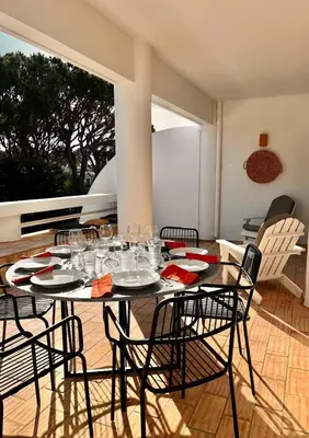 a dining room with a table and chairs at Casa Vale do Lobo in Vale do Lobo