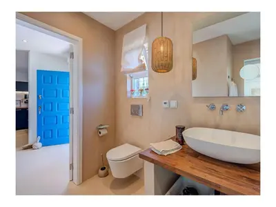 a bathroom with a white sink and a toilet at Casa Monte Algarve Comfortable holiday residence in Loulé