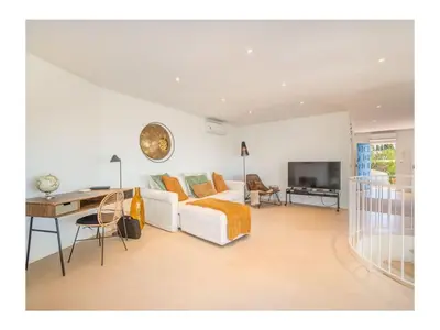a bedroom with a bed and a desk and a television at Casa Monte Algarve Comfortable holiday residence in Loulé