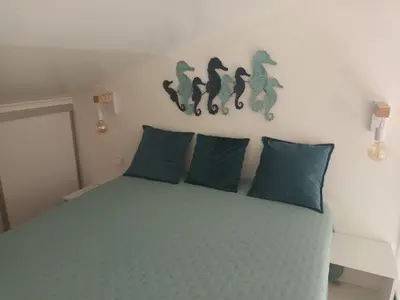 a hallway leading to a living room with a couch at Almar Studio - Albufeira - Praia dos pescadores in Albufeira