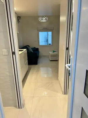 a kitchen with a sink and a tv on the wall at Almar Studio - Albufeira - Praia dos pescadores in Albufeira