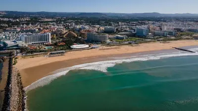 an aerial view of a beach and the ocean at T3 Triplex Vista Mar Marina de Vilamoura-Greice Homes in Vilamoura