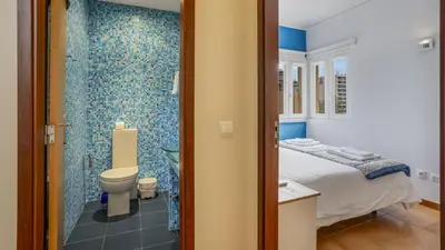 a bathroom with a bed and a toilet and a shower at T3 Triplex Vista Mar Marina de Vilamoura-Greice Homes in Vilamoura
