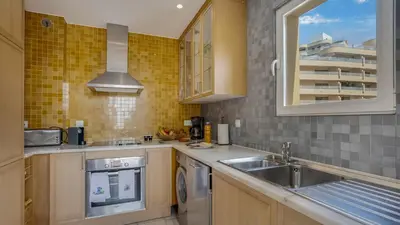 a kitchen with a sink and a dishwasher at T3 Triplex Vista Mar Marina de Vilamoura-Greice Homes in Vilamoura