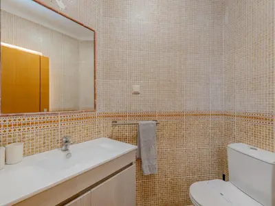 a bedroom with a large bed and a window at Villa Carmen by Interhome in Terras Novas