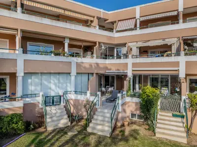 a dining room with a glass table and chairs at Apartment T2 Cassias VIP Properties by Interhome in Vilamoura