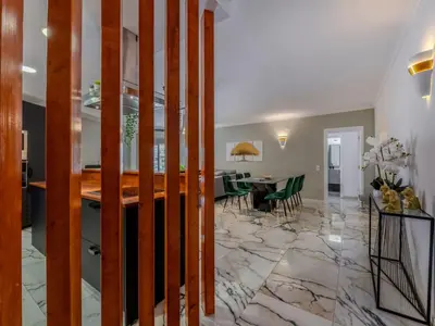 a kitchen and dining room with a marble floor at Apartment T2 Cassias VIP Properties by Interhome in Vilamoura