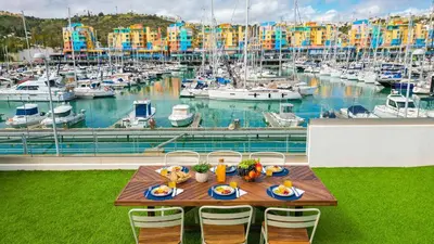 a table with plates of food on top of a marina at Villa Dolce Vita by Algarve Vacation in Albufeira