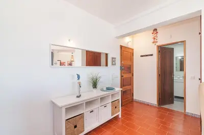 a bathroom with a counter and a sink in a room at Quarteira Mar à Vista T1 in Quarteira