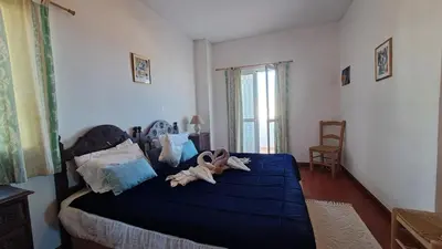 a bedroom with a bed with two dolls on it at Albufeira Seaview 4 Beach HOUSE in Albufeira