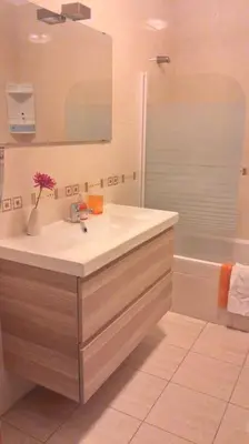 a bathroom with a sink and a mirror and a tub at Lovely 2 Bedroom S Jose Apartment in Albufeira