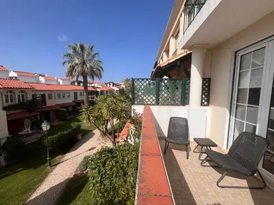 a balcony of a house with two chairs at Old Village, 2 bedrooms, 5 ppl, Beach, Golf, Padel in Vilamoura