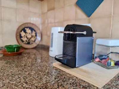 a toaster sitting on top of a kitchen counter at Fig Villa- CleverDetails, Sleep 8, Pool, Children Playground, Ténis court in Vilamoura