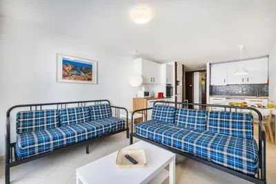 a large swimming pool in front of a building at Family Holidays @ Caminho do Lago in Quarteira