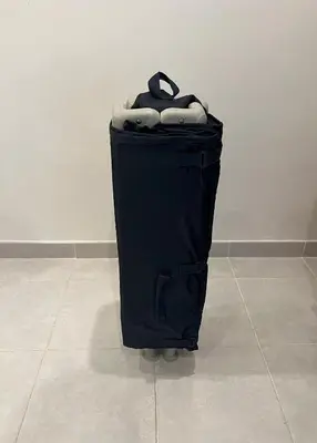 a black trash can sitting on a tile floor at O Limoeiro - 154949/AL in Faro