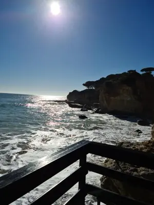 a view of the ocean from a pier at APARTAMENTOS CABRITA in Olhos de Água