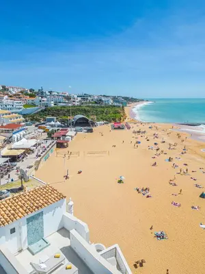 an aerial view of a beach with people on it at Casa na Muralha - Beach front - Rooftop Jacuzzi by DreamvillasAlbufeira in Albufeira