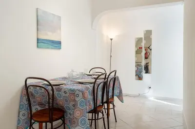 a dining room with a table and chairs at Blife Allya private rooms in Faro