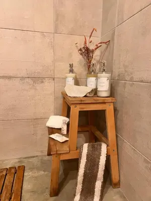 a small table with three candles on top of it at Casa da vila in Faro