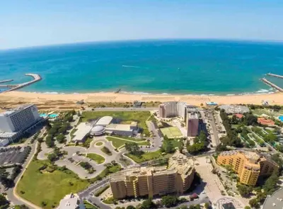 an aerial view of a resort and the beach at Estúdio Vista Mar em Vilamoura in Quarteira