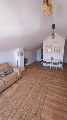 a living room with a couch and a table at Carmo City Center 3 in Faro