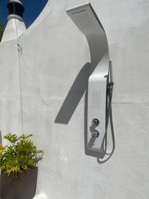 a wall with a wall mounted thermostater on a wall at Casa eden garden in Albufeira