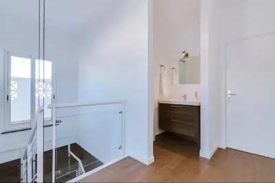 a white bathroom with a sink and a mirror at Blife Frankya private rooms in Faro
