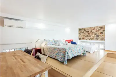 a white room with a bed and a table at Blife Galya private rooms in Faro