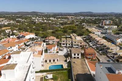 an aerial view of a town with houses at Vila Branca - V3 by HD PROPERTIES in Quarteira