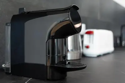 a black and white toaster sitting on a counter at Modern Retreat 1 in Faro by Lovelystay in Faro