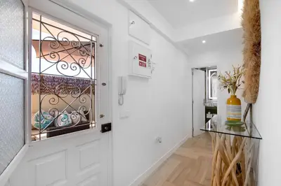 a living room with a couch and an umbrella at Luxury Sweet Homes T2 in Faro