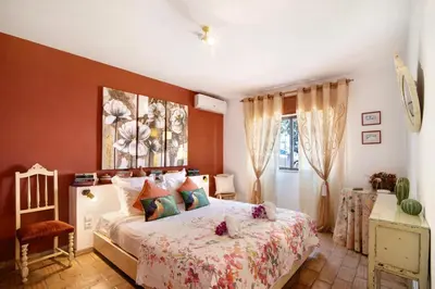 a bedroom with a bed and a window at Country House Casa Da Avó in Loulé