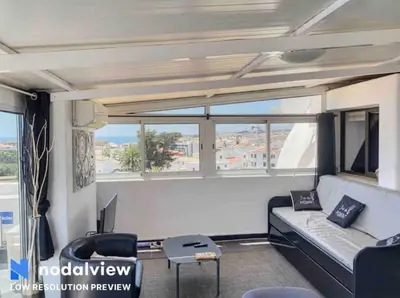 a living room with a couch and a table at RoofTOP Everest : vue mer panoramique amazing in Albufeira