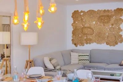 a living room with a couch and a table at Downtown Bingo Apartment in Faro