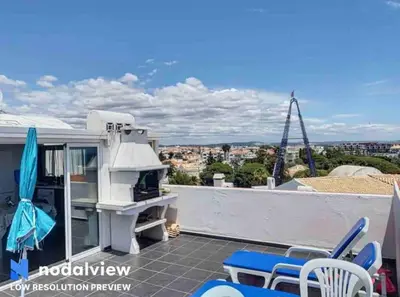 a patio with a grill on the roof of a house at Double ROOFTop Mont-Blanc : vue plage amazing in Albufeira