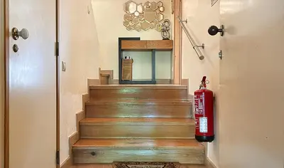 a fire hydrant is standing next to a set of stairs at Vista Marina Exclusiva T1 HsR Vilamarina in Quarteira