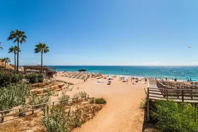 a living room with a fireplace and a couch at Sea View, Beach 3 minutes in Albufeira