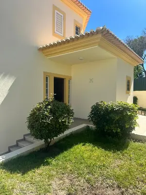 a white house with two bushes in front of it at Benvindo Villa by Umbral in Albufeira