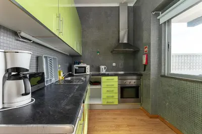 a kitchen with a counter with a coffee maker at Blife Bandaya private apartment in Faro