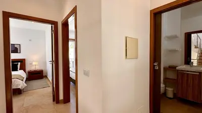 a room with a door leading to a bedroom at Lotus by Check-in Portugal in Quarteira