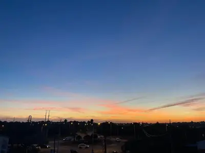 a view of a city at sunset at Stela ' s Guest House in Loulé