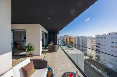an apartment balcony with a view of a city at Terracos de Quarteira Blue by Real Properties in Quarteira