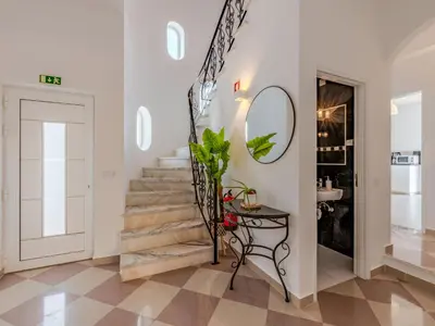 a bathroom with a white sink and a mirror at Villa Villa dos Sonhos V3 Lucia-VIP Properties by Interhome in Galé