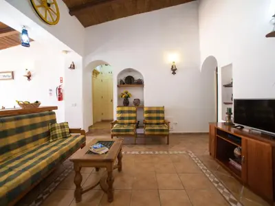 a living room with a couch and a tv at Holiday Home Monte da Calma by Interhome in Albufeira