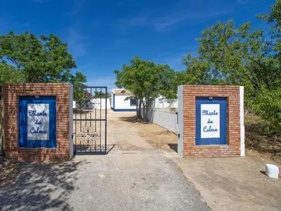 two brick gates with signs that say pinch of chapel at Holiday Home Monte da Calma by Interhome in Albufeira